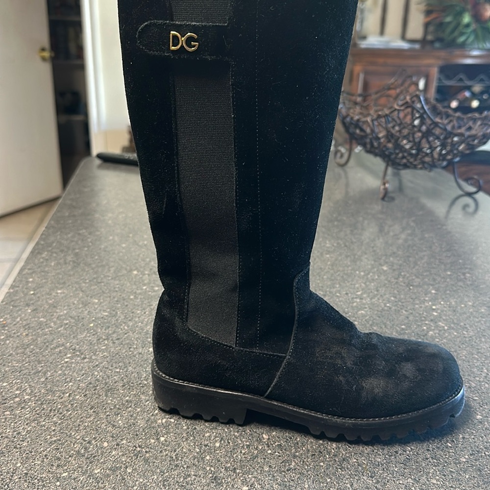 Girls black suede Dolce and Gabbana boots.